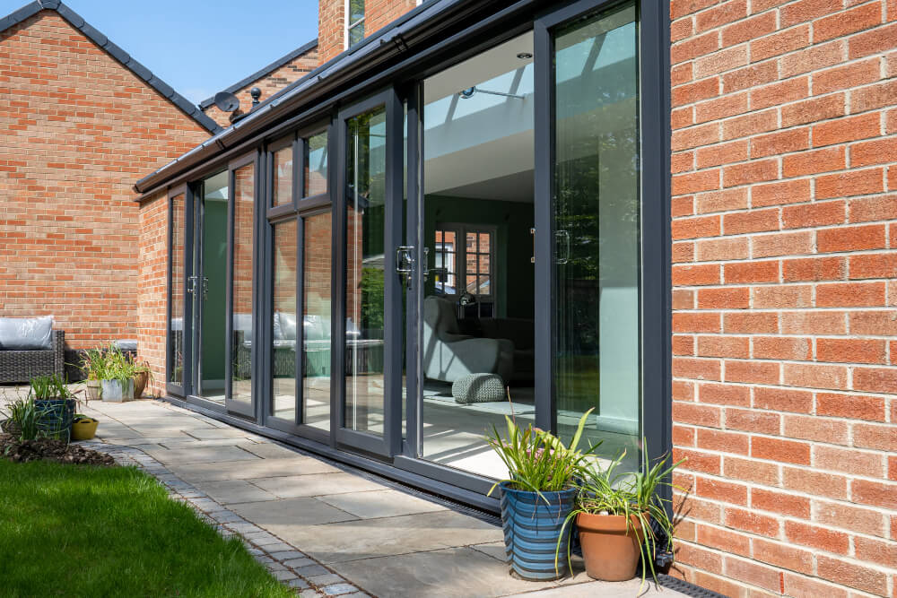 sliding patio doors installed in an orangery