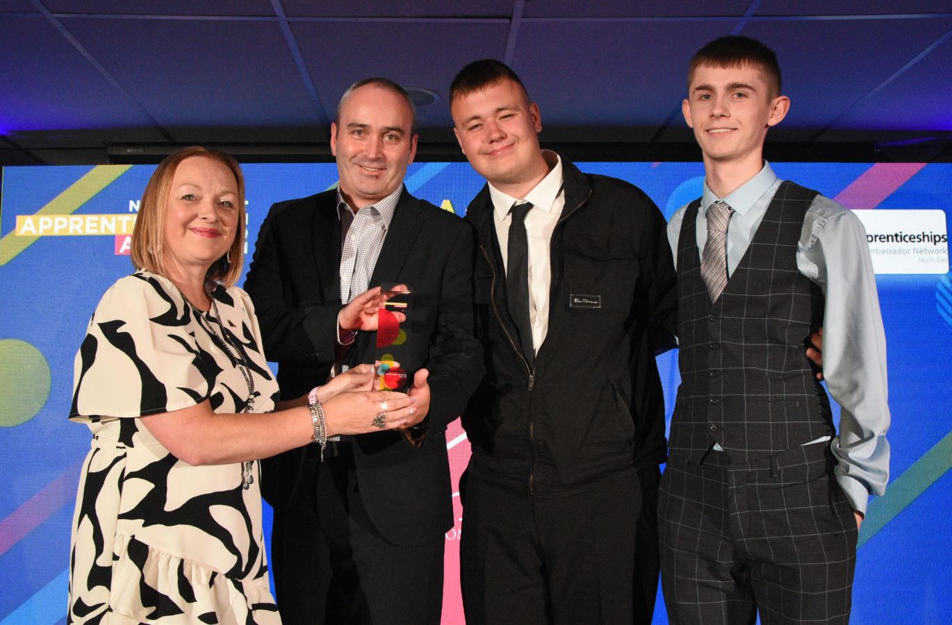 Chris Green and apprentices, Kane and Callum at the 2024 North East Apprenticeship Awards receiving the "SME Employer of the Year" award.
